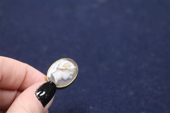 A 19th century yellow metal and sardonyx oval cameo stick pin, carved with the bust of Hermes to sinister, signed in Greek,